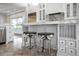Island kitchen with marble countertops, stainless steel appliances, and custom cabinetry at 9050 San Martin Ne Blvd, St Petersburg, FL 33702