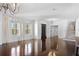 Elegant living room with hardwood floors and stunning chandeliers at 9050 San Martin Ne Blvd, St Petersburg, FL 33702
