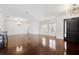 Spacious living area with hardwood floors and large windows offering natural light at 9050 San Martin Ne Blvd, St Petersburg, FL 33702