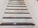 Elegant staircase with marble steps and dark wood accents at 9050 San Martin Ne Blvd, St Petersburg, FL 33702