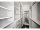 Spacious walk-in closet with custom built-in shelving and drawers at 9050 San Martin Ne Blvd, St Petersburg, FL 33702