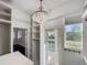 Spacious walk-in closet with custom shelving, hanging rods, and exterior access at 9050 San Martin Ne Blvd, St Petersburg, FL 33702