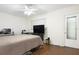 Bright bedroom with a bed, TV, and plenty of space at 1000 79Th N Ave # 102, St Petersburg, FL 33702
