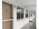 Exterior hallway view of condo building, showing multiple unit entrances at 1000 79Th N Ave # 102, St Petersburg, FL 33702
