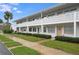 Clean exterior with palm trees and walkway in front at 1000 79Th N Ave # 102, St Petersburg, FL 33702