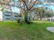 Well-manicured green space with mature trees provides a serene backdrop for community living at 1000 79Th N Ave # 102, St Petersburg, FL 33702