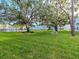 Sprawling green space with lush lawns and mature trees creating a park-like setting for residents at 1000 79Th N Ave # 102, St Petersburg, FL 33702
