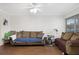 Living area with two brown couches and wood-look flooring at 1000 79Th N Ave # 102, St Petersburg, FL 33702