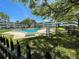 Community pool, with well-maintained grounds, offers a refreshing escape and enhances the outdoor living experience at 1000 79Th N Ave # 102, St Petersburg, FL 33702