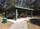 Park picnic pavilion with tables and benches under a roof at 10019 N Hyaleah, Tampa, FL 33617