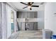 Kitchen with gray cabinets, tile backsplash, and vinyl plank flooring at 10217 Bannister St, Spring Hill, FL 34608