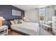 Spacious bedroom with a large bed, window, and neutral decor at 10266 Kalamazoo Pl, Parrish, FL 34219