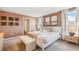 Bright bedroom featuring a king-size bed and ensuite bathroom access at 10266 Kalamazoo Pl, Parrish, FL 34219