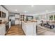 Modern kitchen with white cabinets, granite island, and stainless steel appliances at 10266 Kalamazoo Pl, Parrish, FL 34219