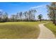 Landscaped walking path meanders along the golf course at 10500 Old Tampa Bay Dr, San Antonio, FL 33576