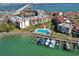 Aerial view of waterfront community with pool, boat slips, and lush landscaping at 106 1St E St # 115, St Petersburg, FL 33715