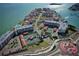 Aerial view of waterfront community with tennis courts and pool at 106 1St E St # 115, St Petersburg, FL 33715