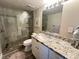 Updated bathroom with granite vanity, walk-in shower, and modern fixtures at 106 1St E St # 115, St Petersburg, FL 33715