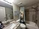 Updated bathroom with granite vanity and relaxing shower/tub combo at 106 1St E St # 115, St Petersburg, FL 33715