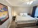 Bright bedroom with a queen-size bed and ample closet space at 106 1St E St # 115, St Petersburg, FL 33715