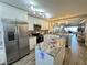 Modern kitchen with stainless steel appliances and granite island at 106 1St E St # 115, St Petersburg, FL 33715