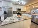 Granite island kitchen with stainless steel appliances at 106 1St E St # 115, St Petersburg, FL 33715