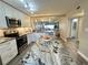 Modern kitchen featuring granite countertops and stainless steel appliances at 106 1St E St # 115, St Petersburg, FL 33715