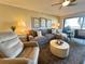 Spacious living room with comfortable sectional sofa and large windows at 106 1St E St # 115, St Petersburg, FL 33715
