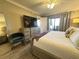Main bedroom with king bed and access to balcony at 106 1St E St # 115, St Petersburg, FL 33715