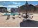 Relaxing pool area with lounge chairs and thatched umbrellas at 106 1St E St # 115, St Petersburg, FL 33715