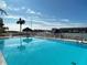 Inviting community pool with water views and lounge chairs at 106 1St E St # 115, St Petersburg, FL 33715