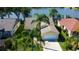 House with lake view and lush green landscape at 11507 Whispering Hollow Dr, Tampa, FL 33635