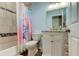 Charming bathroom with a unicorn shower curtain at 11507 Whispering Hollow Dr, Tampa, FL 33635