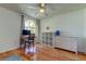 Bedroom with wood floors, a desk, and built-in shelves at 11507 Whispering Hollow Dr, Tampa, FL 33635