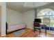 Bedroom with wood floors, a desk, and a twin bed at 11507 Whispering Hollow Dr, Tampa, FL 33635