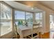 Bright dining area with lake view and wood floors at 11507 Whispering Hollow Dr, Tampa, FL 33635