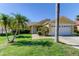 Well-maintained house with attractive landscaping and two-car garage at 11507 Whispering Hollow Dr, Tampa, FL 33635
