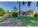 House exterior showcasing backyard and lake view at 11507 Whispering Hollow Dr, Tampa, FL 33635