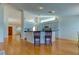 Open kitchen features an island and hardwood floors at 11507 Whispering Hollow Dr, Tampa, FL 33635