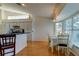 Kitchen with island, white cabinets, and wood floors at 11507 Whispering Hollow Dr, Tampa, FL 33635