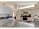 Bright kitchen features granite countertops and stainless steel appliances at 11507 Whispering Hollow Dr, Tampa, FL 33635