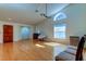Living room with hardwood floors and a vaulted ceiling at 11507 Whispering Hollow Dr, Tampa, FL 33635