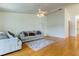 Spacious living room with hardwood floors and ample natural light at 11507 Whispering Hollow Dr, Tampa, FL 33635