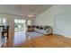 Living room with hardwood floors, sliding doors to patio, and lake view at 11507 Whispering Hollow Dr, Tampa, FL 33635