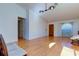 Light-filled living room with hardwood floors and entryway at 11507 Whispering Hollow Dr, Tampa, FL 33635
