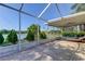 Relaxing screened porch overlooking a tranquil lake at 11507 Whispering Hollow Dr, Tampa, FL 33635