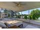 Serene screened porch with lake views and chaise lounge at 11507 Whispering Hollow Dr, Tampa, FL 33635