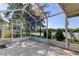Enjoy lake views from this screened porch at 11507 Whispering Hollow Dr, Tampa, FL 33635