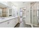 Double vanity bathroom with a large walk-in shower at 11654 Stone Pine St, Riverview, FL 33569