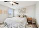 Cozy bedroom with a patterned bedspread and a wooden nightstand at 11654 Stone Pine St, Riverview, FL 33569